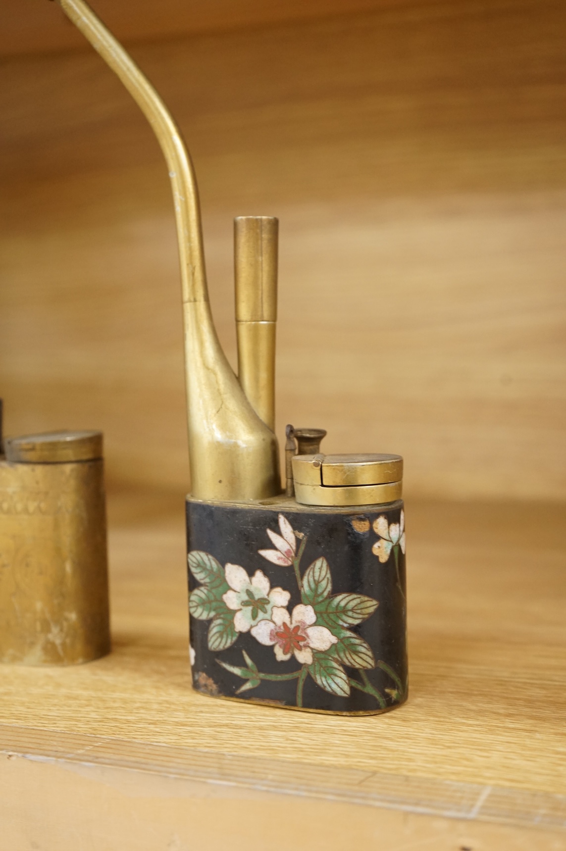 A Chinese cloisonné enamel and brass water pipe and an engraved example, largest 36cm high